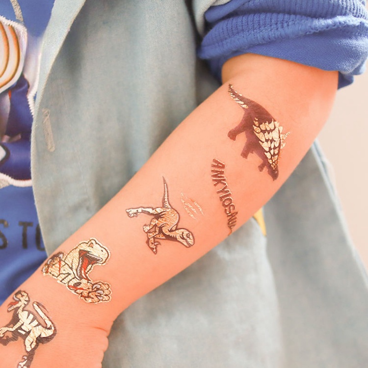 Kid dinosaur metallic arm tattoo